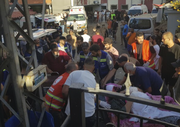 Civil Defense first-responders carry a man who was wounded after his handheld pager exploded, in the southern port city of Sidon, Lebanon, Tuesday, Sept. 17, 2024