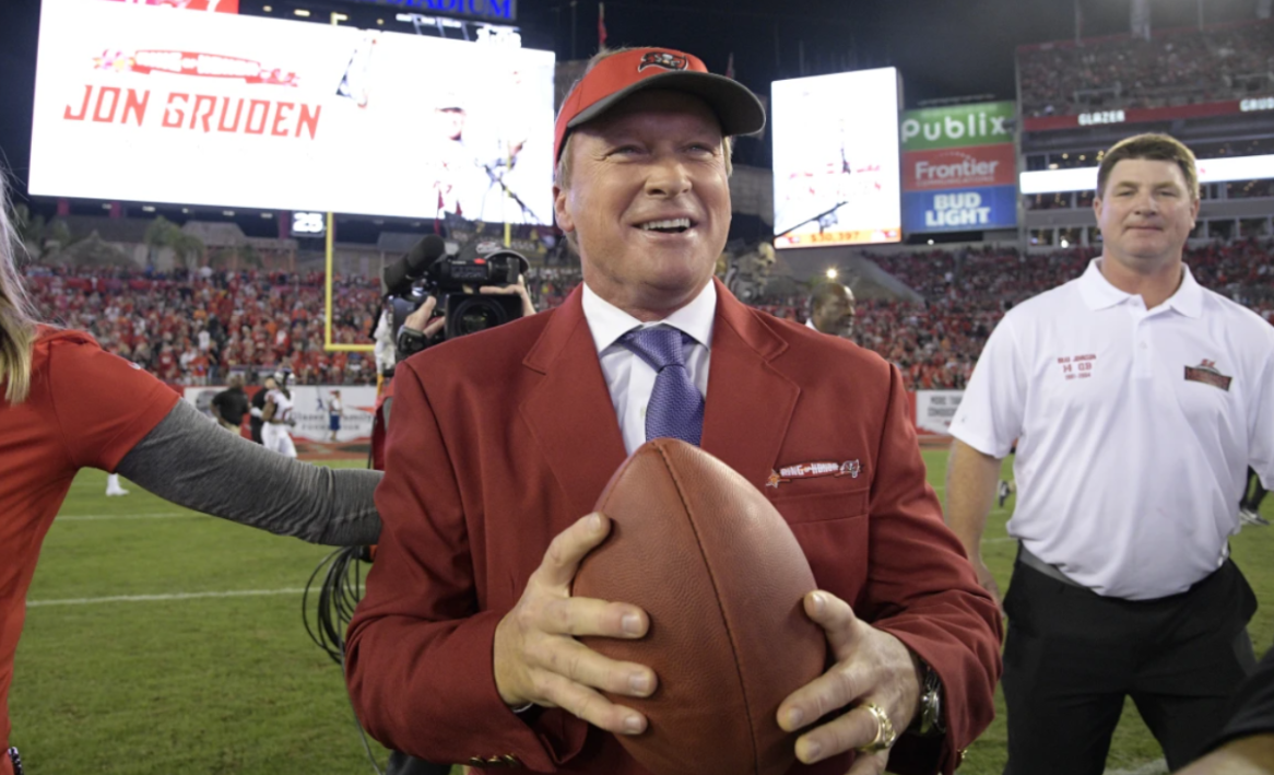 Former Tampa Bay Buccaneers head coach Jon Gruden (center) reaction to being inducted into the Buccaneers 
Ring of Honor on Monday, Dec. 18, 2017, in Tampa, Florida | Image Credit: Phelan M. Ebenhack
